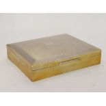 A HM silver table top cigarette case with engine turned decoration and wood lined interior.