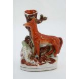 A Staffordshire flat backed spill vase with fox and goose on an oval base. 19thC. 8 3/4'' high.