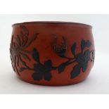 A c.1900 Japanese lacquered open circular pot with floral and foliate relief decoration to sides. 2"