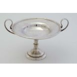 A silver 2 handled pedestal dish hallmarked Sheffield 1909 maker Walker & Hall 4" high (106g)