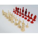 A complete 19thC Ivory and stained ivory chess set. The Kings being 3 3/4'' high. (16) CONDITION: