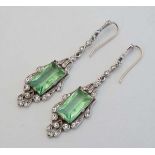 A pair of white metal drop earrings set with green and white stones  CONDITION: Please Note -  we do