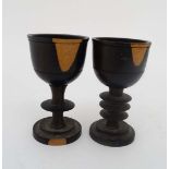 A pair of turned Lignum Vitae  pedestal