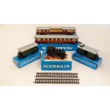 A collection of five blue boxed Marklin models comprising Luggage Van 4008, Passenger Coach 4007,