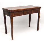 A late 18thC inlaid mahogany fold over tea table standing ion four squared legs with one hinging and