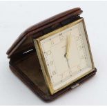 Art Deco Travel Clock : A 1930' s Smith's Travel Alarm Clock of squared form in a lizard leather