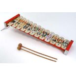 A c1940s tin child's toy Xylophone, the keys decorated with images of a selection of characters from