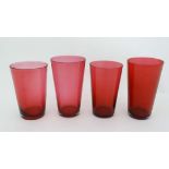 4 various Cranberry glass beakers of tapering form . The tallest 4" high  CONDITION: Please