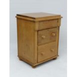 A 19thC Bedside cabinet / narrow pine chest comprising frieze drawer and 2 graduated long drawers