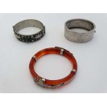 3 assorted bangles to include a silver bangle hallmarked Birmingham 1935, a white metal bangle