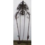 Well Head : a painted and wrought iron well head having a plume to top and a wheel with chain (