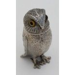 A novelty silver plate pepperette formed as an owl with glass eyes. 3" high  CONDITION: Please