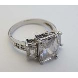 A white gold ring marked 10kt set with white stones  CONDITION: Please Note -  we do not make