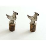 A pair of Danish white metal bottle stoppers / pourers in the form of birds, marked Meka