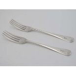 A pair of Geo III silver table forks. Hallmarked York 1804 maker Hampston Prince & Cattles .