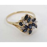 A 9ct gold ring set with diamonds and sapphires  CONDITION: Please Note -  we do not make