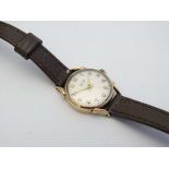 9 ct Gold Ladies Tissot Watch : A .375 gold Tissot blue leather cased Ladies Wrist Watch , having