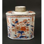 A Chinese tea caddy with blue , red and gilt floral and foliate decoration on a white ground.