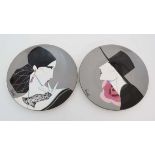 A pair of polychrome Poole plates depicting women dressed in a 1980s Spanish style. Signed. Poole