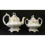 A ceramic teapot and matching sugar scurier. With gilt stylised floral and foliate decoration on a