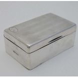 A silver table top cigarette box with wood lined interior . Hallmarked Birmingham 1923 maker William