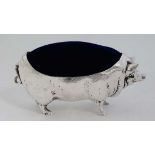 A novelty silver plate pin cushion formed as a pig with blue velvet back 4" long  CONDITION: