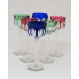 A set of 5 Bohemian hock glasses, the coloured bowls with clear tapering hexagonal stems on clear