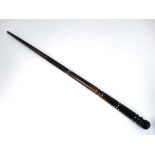 An African turned tapering walking stick with ivory dot inlay 34 1/2" long  CONDITION: Please Note -