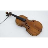 Musical Instruments : A 3/4 size student's violin , bears label within ' Antonius Stadivarius