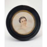 A Victorian circular watercolour miniature - bust portrait of a young girl 3 3/8" diameter in