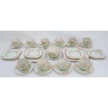 A Hand painted Pallisy 10 sitting tea service with crocus decoration. Consisting of 10 cups, 10