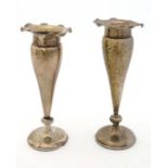 Chinese Export Silver : A pair of silver vases with weighted bases and flared rims marked WH 90