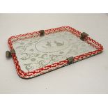 A 1950's glass tray with mirrored reverse intaglio wheel cut decoration and border of 2 red