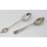 Two Silver jubilee commemorative silver teaspoons . Hallmarked London 1934 maker Josiah Williams &