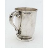 A silver mug with acanthus detail to handle Birmingham 1924 maker Henry Williamson Ltd. approx 4 3/