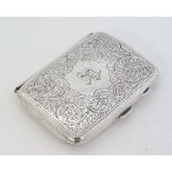 A silver cigarette case with engraved acanthus scroll decoration. Hallmarked Birmingham 1917 maker