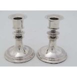 A pair of silver candle sticks hallmarked London 1910 maker Mappin & Webb Ltd. 4" high  CONDITION: