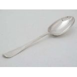 A silver Hanovaina pattern dessert spoon with rat tail to bowl. Hallmarked London 1938 . 6 3/4" long