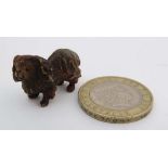 A cold painted bronze figure of a Pekinese dog standing 1 1/8" long  CONDITION: Please Note -  we do