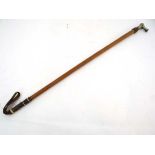 A mid 19thC Whip by Swaine & Co , London . 23" malacca shaft terminating in a short chequered