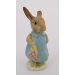 A Beswick Beatrix Potter figure of '' Mrs Flopsy Bunny '' with gold oval back stamp. 4 1/4'' high