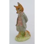 A Beswick Beatrix Potter figure of '' Foxy Whiskered Gentleman '' with gold oval back stamp. 4 1/4''