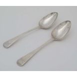 A pair of Geo III silver Old English pattern table spoons. Hallmarked London 1813 maker Solomon