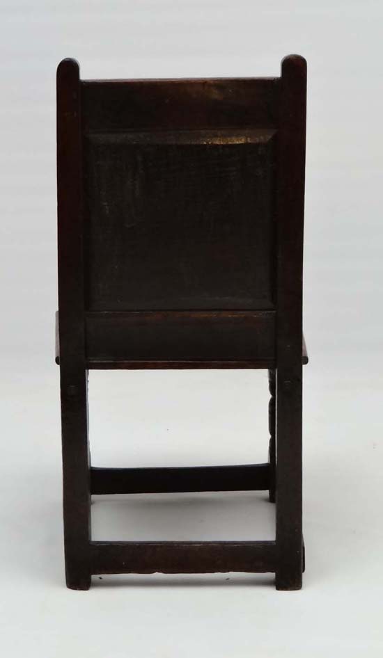 A 17thC carved oak solid seat single chair with panel back . 33" high x 17 3/4" wide x 15" deep - Image 4 of 4
