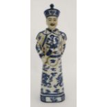 A blue and white Chinese figurine of Qing dynasty Emperor Qianlong Marked to base. 18'' High.