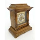 HAC Oak cased mantle clock : an 14 day Strike brass dial mantle clock with silvered cushion