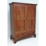 A 19thC small proportion mahogany double wardrobe with boxwood inlaid doors and 2 short drawers