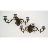 A  pair of brass and porcelain 3 branch wall lights  formed as scrolling acanthus with handpainted