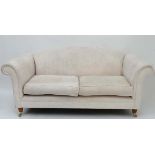 Laura Ashley : A damask silk cream upholstered large 2-seat sofa with scroll arms and hump back on