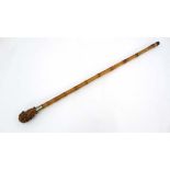 A c.1900 walking stick / cane with bamboo shaft, nickel collar and bamboo root knop. 32 1/8" long